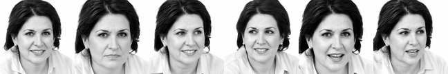 A smiling woman with short dark hair