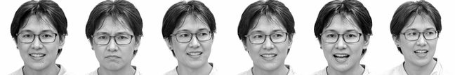 A smiling woman with short hair and glasses